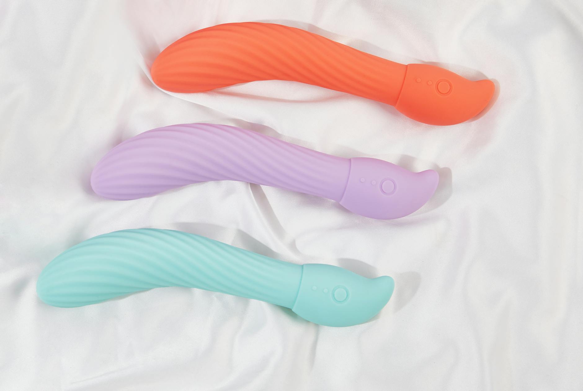 Person holding lemon clitoral vibrator, exploring sensation and personal pleasure